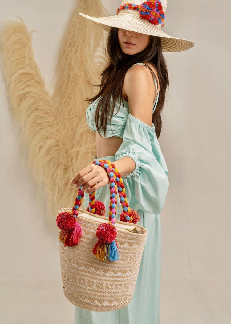 Handmade Wayuu bag with colored pom poms
